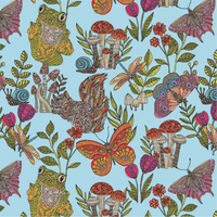 surgical scrub hat fabric with a pattern of animals, plants, and insects on a light blue background