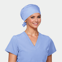 A person wearing a light blue scrub hat and matching scrub top.