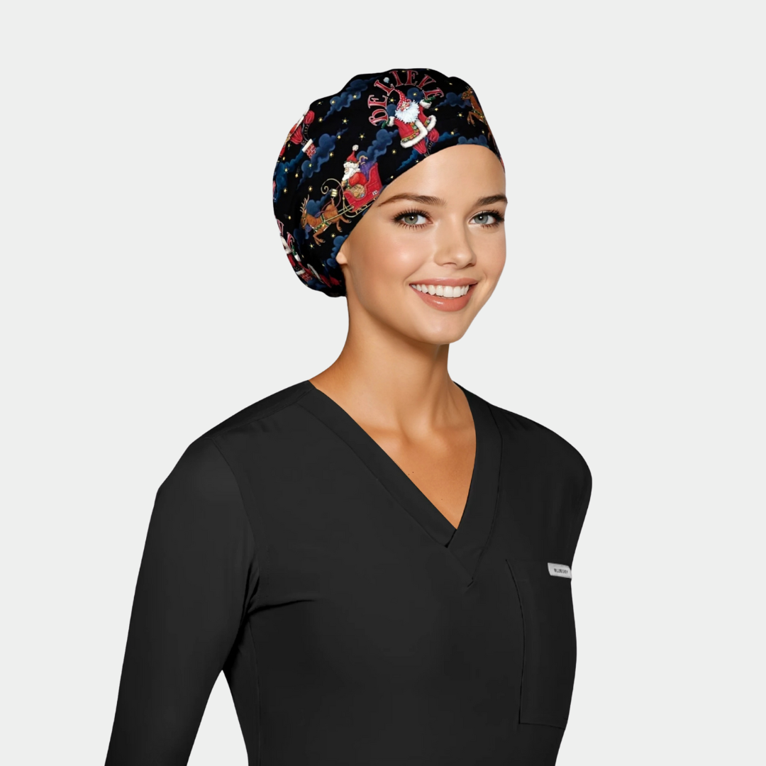 a woman wearing a black scrub top with a christmas themed scrub hat on that is black with Santas on it.