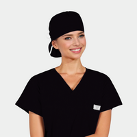 Person wearing a black scrub top and solid black cap on a white background
