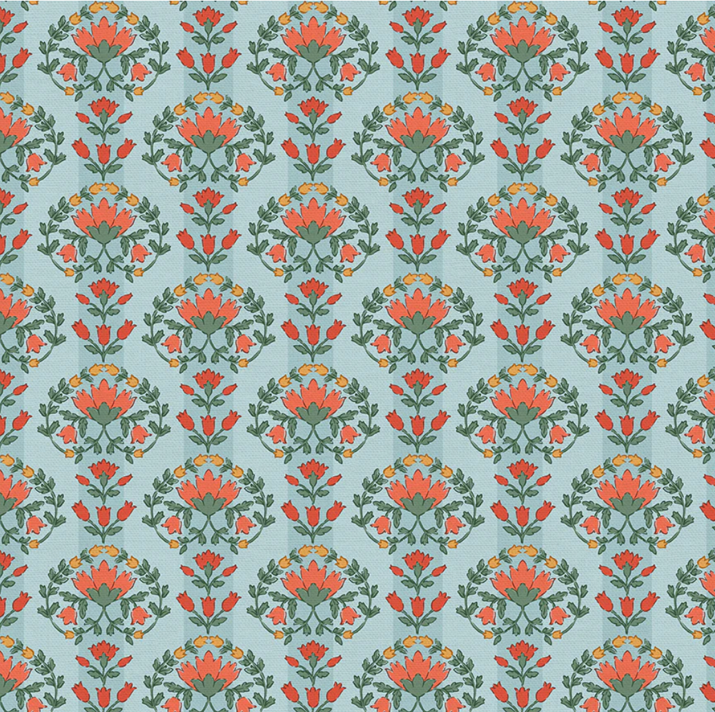 A repeating floral damask pattern with coral-orange flowers, green leaves, and small yellow accents on a pale blue background.