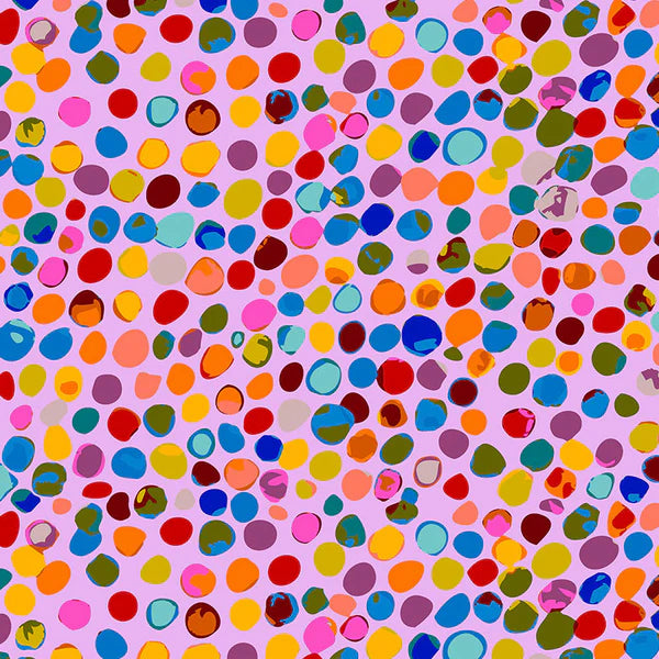 scrub hat fabric with multicolored polka dots on a pink background