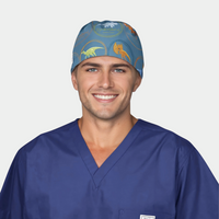 man wearing a navy blue scrub top and a blue scrub hat with dinosaurs on it on a white background