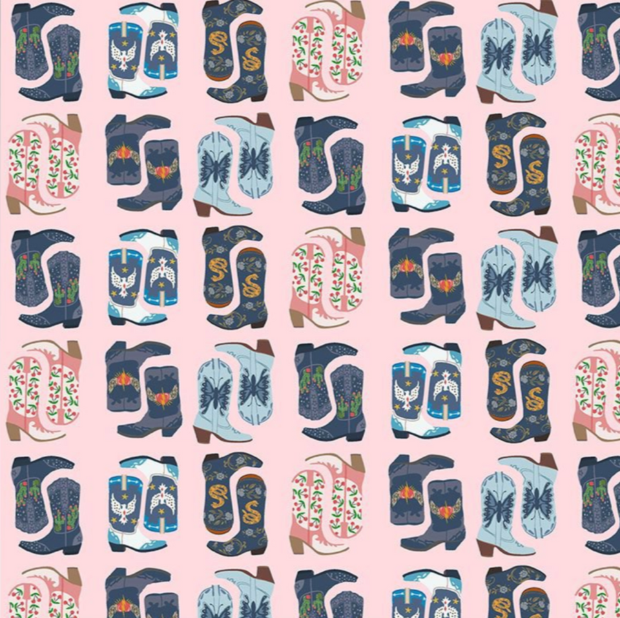 scrub cap fabric that has blue cowboy boots on a pink background