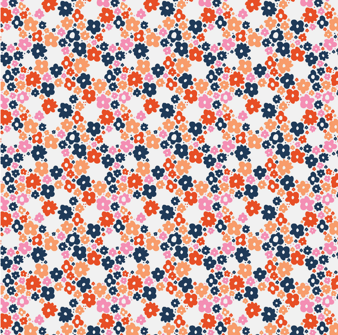 scrub hat fabric pattern of small flowers in various colors on a white background