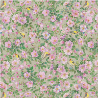 scrub hat fabric with a pattern of pink flowers and small birds on a light green background