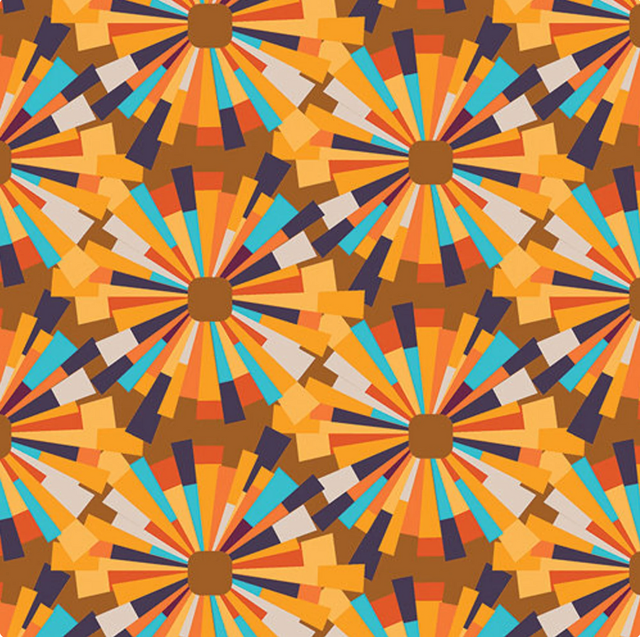 a scrub hat fabric with a geometric pattern with sunburst design in orange, blue, and brown colors.
