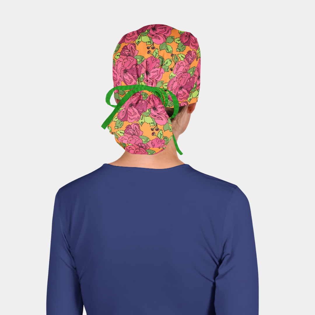 Scrub cap with colorful floral pattern on a plain background