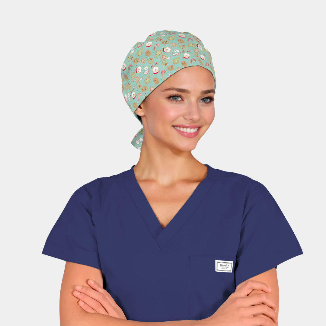 woman wearing a navy blue scrub top and a christmas scrub cap that is light green with santas on it