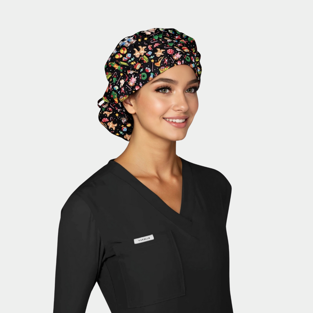 woman wearing a black scrub top and a christmas bouffant scrub hat that is black with toys on it on a white background.