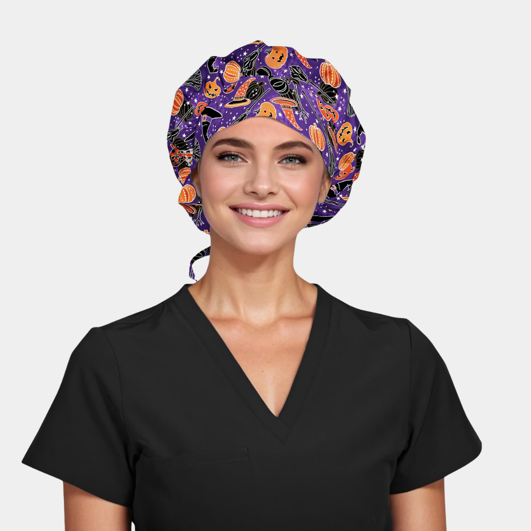 woman wearing black scrubs and a bouffant scrub hat that is purple with halloween pumpkins and hats and brooms