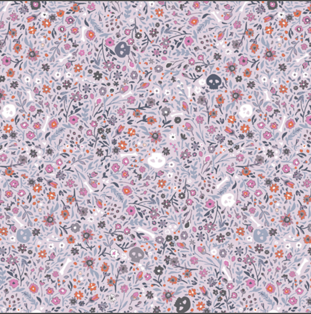 A dense, all-over floral pattern with small flowers and leaves in pink, orange, purple, gray, and white on a pale lavender background.