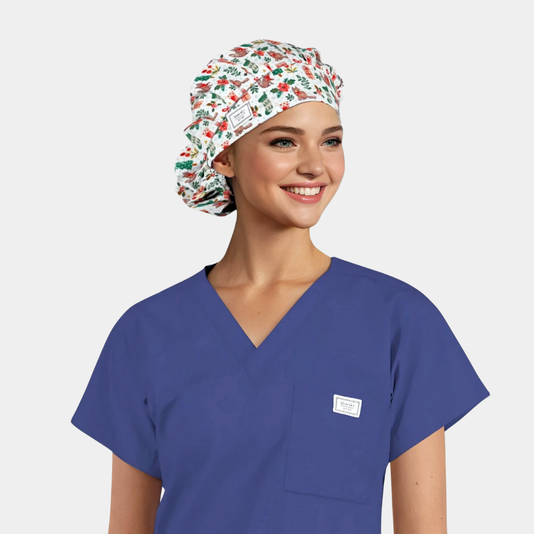 a woman with a christmas bouffant scrub hat on and a navy blue scrub top