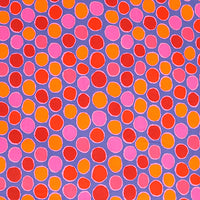 scrub hat fabric with a pattern of colorful circles on a purple background